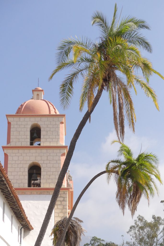 Palm trees and Spanish-style church architecture in Santa Barbara, California